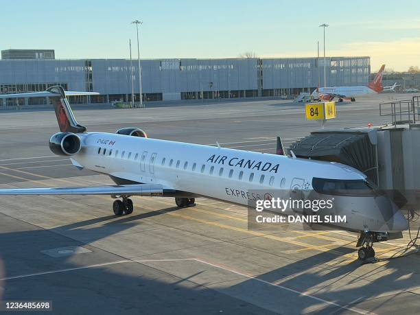 An Air Canada aircraft is seen at the gate on November 10, 2021 at Montreal-Pierre Elliott Trudeau International Airport in Montreal, Canada.