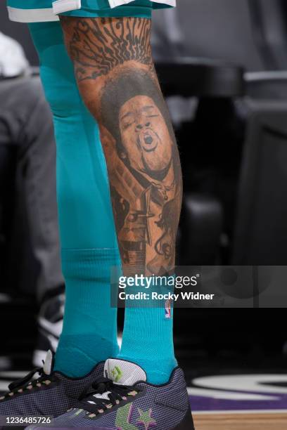 The tattoo belonging to Kelly Oubre Jr. #12 of the Charlotte Hornets in a game against the Sacramento Kings on November 5, 2021 at Golden 1 Center in...