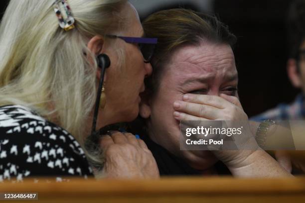 Kyle Rittenhouse's mother Wendy Rittenhouse is comforted by defense jury expert Jo-Ellan Dimitrius as she listens to testimony about Rittenhouse...