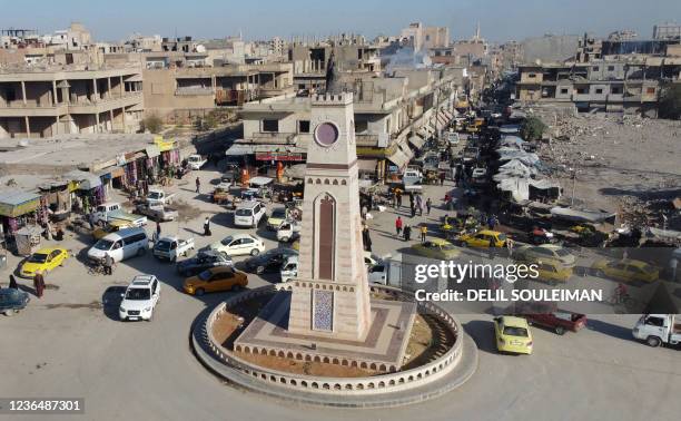 This picture taken no November 6, 2021 shows an aerial view of the Clock Tower Square in Syria's northern city of Raqa, which was formerly used for...