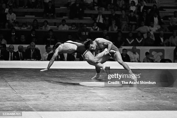 Yojiro Uetake of Japan and Aboutaleb Talebi of Iran compete in the Wrestling Freestyle 57kg round 7 against during the Mexico City Olympic Games at...