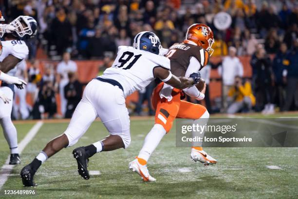 Toledo Rockets Outside Linebacker Jamal Hines sacks Bowling Green Falcons Quarterback Matt McDonald during the first half of the College Football...