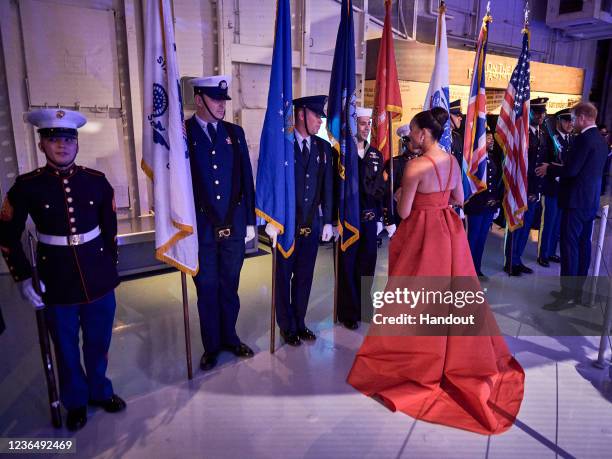 In this handout photo provided by Morganation LLC, Prince Harry, Duke of Sussex, and Meghan, Duchess of Sussex attend Intrepid Museum's annual Salute...