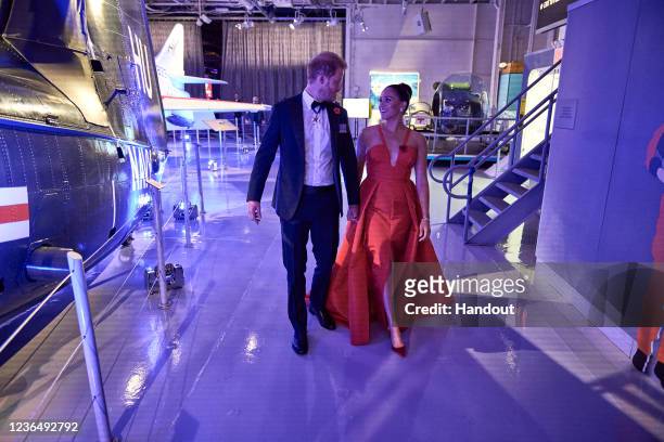 In this handout photo provided by Morganation LLC, Prince Harry, Duke of Sussex, and Meghan, Duchess of Sussex attend Intrepid Museum's annual Salute...