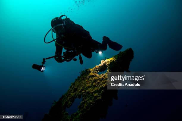 Divers inspect the 120-meter-long "H.M.S. Majestic" shipwreck at a depth of 24 meters in the first World War I themed underwater park "Gallipoli...