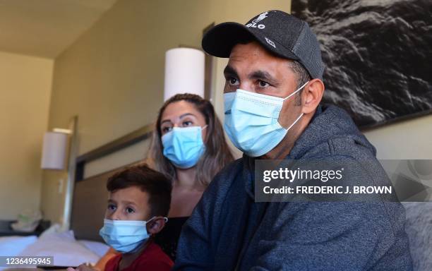 Luis Padilla from Colombia with his wife Magarita and son in their room at a migrant shelter run by Catholic charities in San Diego, California on...