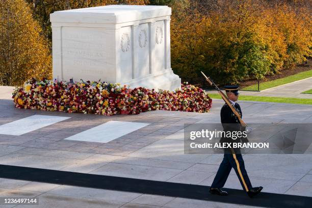 Tomb guard of the 3rd US Infantry Regiment, known as "The Old Guard," walks before a centennial ceremony for the Tomb of the Unknown Soldier, in...