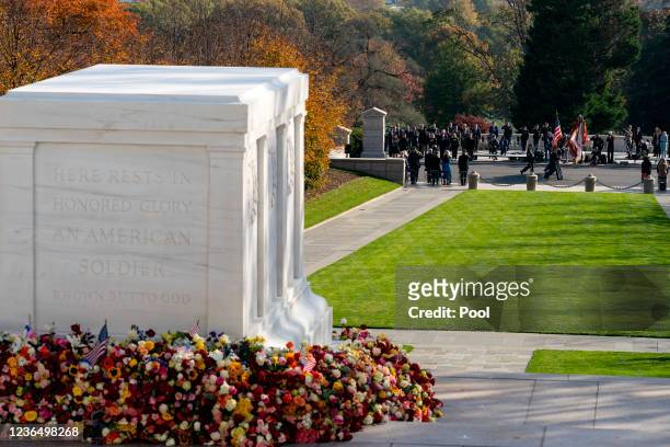 Color guard marches in a procession during a centennial ceremony at the Tomb of the Unknown Soldier in Arlington National Cemetery on November 11 in...