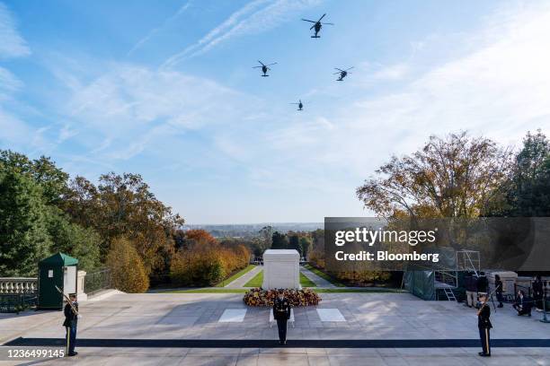 Formation of U.S. Army UH-60 Blackhawk helicopters during a centennial ceremony for the Tomb of the Unknown Soldier at Arlington National Cemetery in...