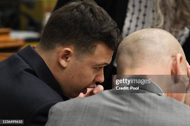 Kyle Rittenhouse talks with defense attorney Cory Chirafisi before the day starts in his trial at the Kenosha County Courthouse on November 11, 2021...