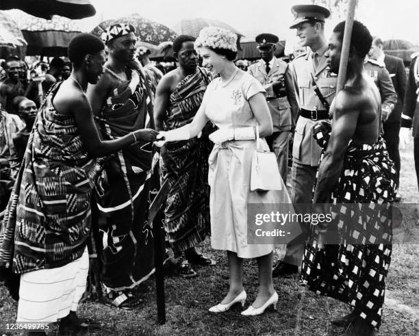 Queen Elizabeth II and Prince Philip, Duke of Edinburgh meets people in Accra as part of a state visit in Ghana on November 17, 1961.