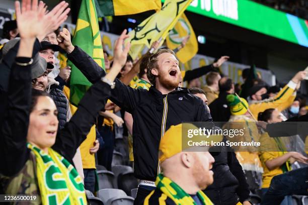 Australian fans sing the national anthem during the World Cup Qualifier football match between Australia Socceroos and Saudi Arabia on November 11,...