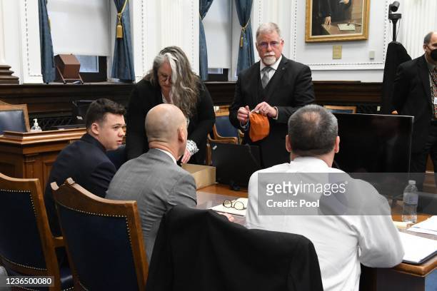 Use of force'' expert witness Dr. John Black , along with Kyle Rittenhouse and defense attorneys speak before the start in Kyle Rittenhouse trial at...