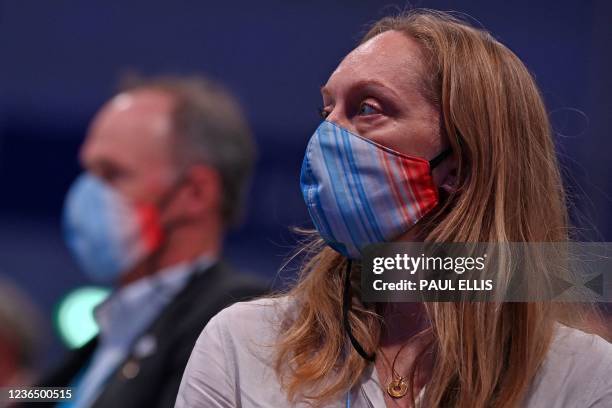 Delegates wear face coverings, due to Covid-19, featuring a global-warming stripe graphic created by University of Reading climate scientist Ed...