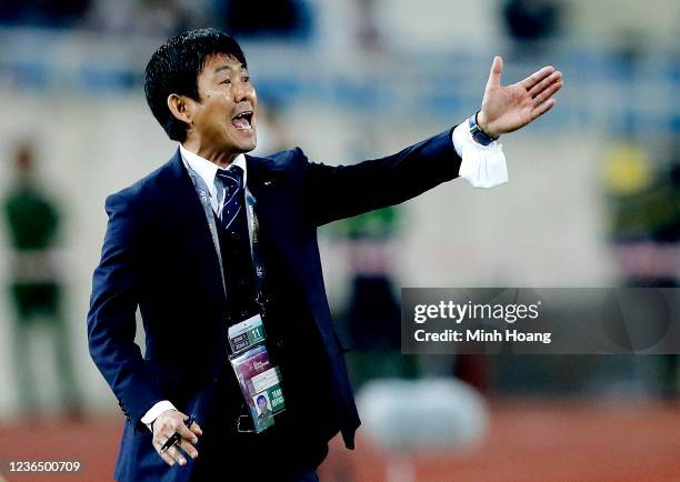 Japan's head coach Hajime Moriyasu reacts during the FIFA World Cup Asian Qualifier final round Group B match between Vietnam and Japan at My Dinh...