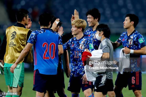 Japan's soccer team react after the FIFA World Cup Asian Qualifier final round Group B match between Vietnam and Japan at My Dinh National stadium on...