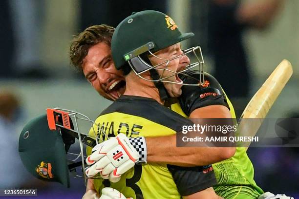 Australia's Marcus Stoinis and Matthew Wade celebrate their victory at the end of the ICC mens Twenty20 World Cup semi-final match between Australia...