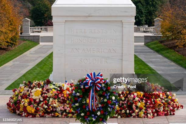 Wreath placed by President Joe Biden rests in front of the Tomb of the Unknown Soldier after a centennial ceremony, in Arlington National Cemetery,...