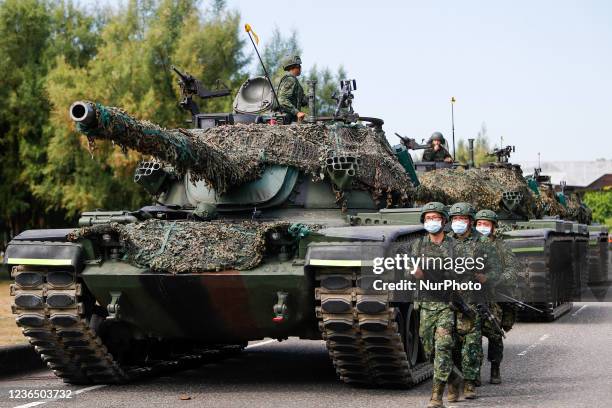 Soldiers patrol as Tanks are deployed during a shore defense operation as part of a military exercise simulating the defense against the intrusion of...