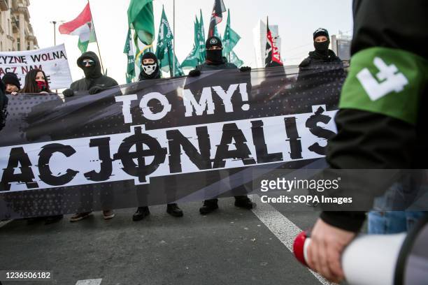 Nationalists hold a banner saying "We are the Nationalists" and wear armbands with the Polish falanga symbol during the Independence March. Poland's...