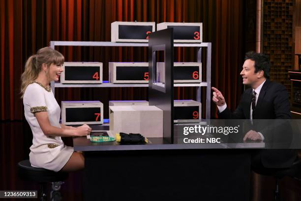 Episode 1549 -- Pictured: Singer-songwriter Taylor Swift and host Jimmy Fallon play "Box of Lies" on Thursday, November 11, 2021 --