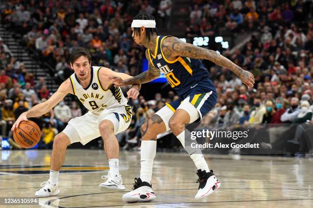 McConnell of the Indiana Pacers drives into Jordan Clarkson of the Utah Jazz during a game at Vivint Smart Home Arena on November 11, 2021 in Salt...