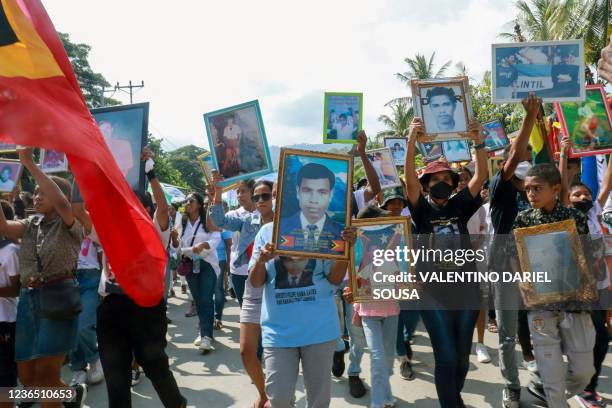 East Timorese take to the streets to commemorate the 30th anniversary of the Santa Cruz massacre in Dili on November 12 to remember when Indonesian...