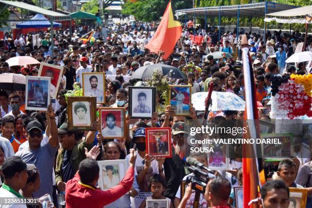 East Timorese take to the streets to commemorate the 30th anniversary of the Santa Cruz massacre in Dili on November 12 to remember when Indonesian...