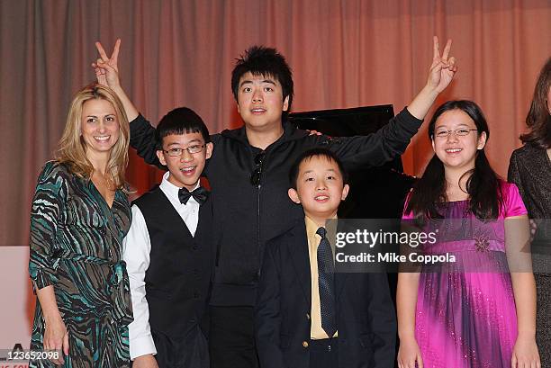 The Anderson School Principal Jodi Hyde, US Young Scholar Derek Wang, pianist Lang Lang, US Young Scholars Charlie Liu, and Anna Larsen pose for a...