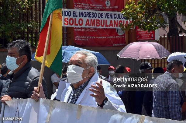 Health workers protest against Bolivian president Luis Arce and a new law under debate in parliament that they allege would allow the government to...
