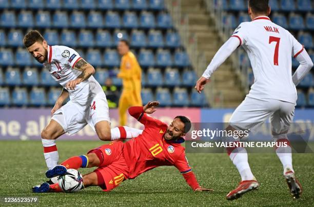 Poland's midfielder Mateusz Klich challenges Andorra's midfilder Ludovic Clemente as Polish forward Arkadiusz Milik looks on during the FIFA World...