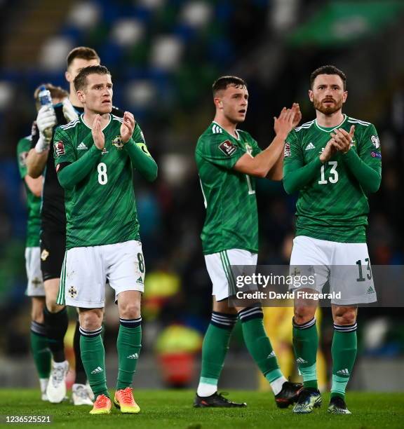 Northern Ireland , United Kingdom - 12 November 2021; Steven Davis, left, and Corry Evans of Northern Ireland applaud the support after the FIFA...