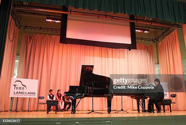 Pianist Lang Lang performs at PS 334 - The Anderson School during his visit on behalf of the VH1 Save The Music Foundation: Lang Lang International...