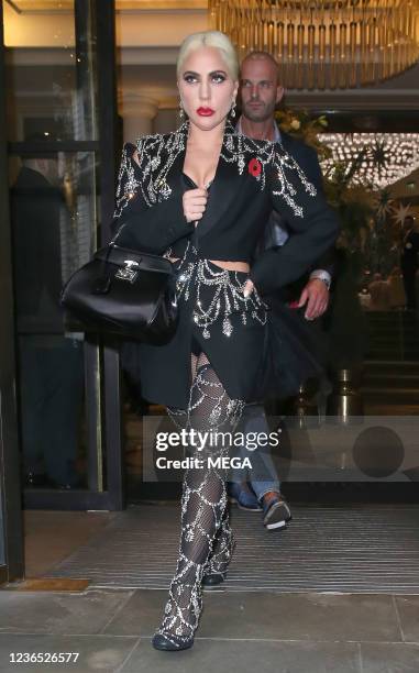 Lady Gaga is seen leaving her hotel wearing a black Gucci outfit to promote her new movie "House Of Gucci" on November 12, 2021 in London, England.