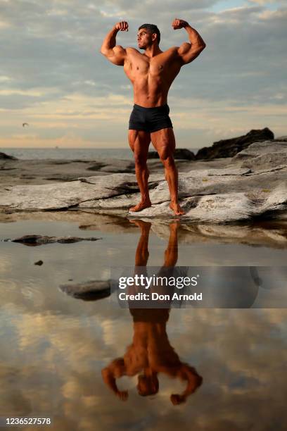 Chris Kavvalos poses during an early morning photo shoot at Little Bay on May 31, 2020 in Sydney, Australia. IFBB body builder Chris Kavvalos has...