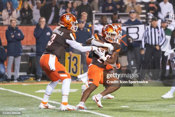 Bowling Green Falcons Quarterback Matt McDonald hands the ball off to Bowling Green Falcons Running Back Jaison Patterson during the first half of...