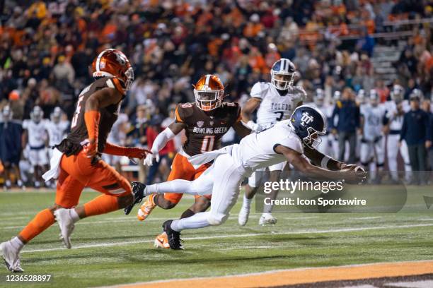 Toledo Rockets Quarterback Dequan Finn runs with the ball for a touchdown during the first half of the College Football game between the Toledo...