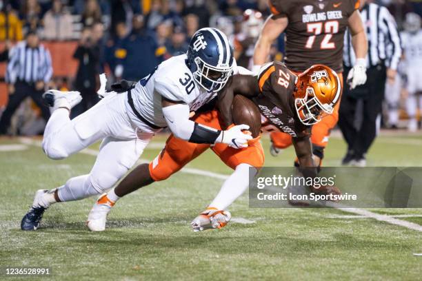 Toledo Rockets Linebacker Jonathan Jones tackles Bowling Green Falcons Running Back Jaison Patterson running with the ball during the first half of...