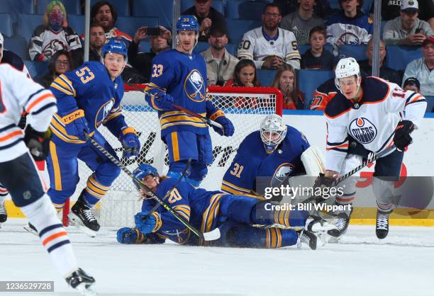 Cody Eakin, Jeff Skinner, Colin Miller and Dustin Tokarski of the Buffalo Sabres defend against the Edmonton Oilers during an NHL game on November...