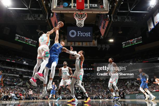 Keldon Johnson of the San Antonio Spurs blocks the shot of Kristaps Porzingis of the Dallas Mavericks during the game on November 12, 2021 at the...