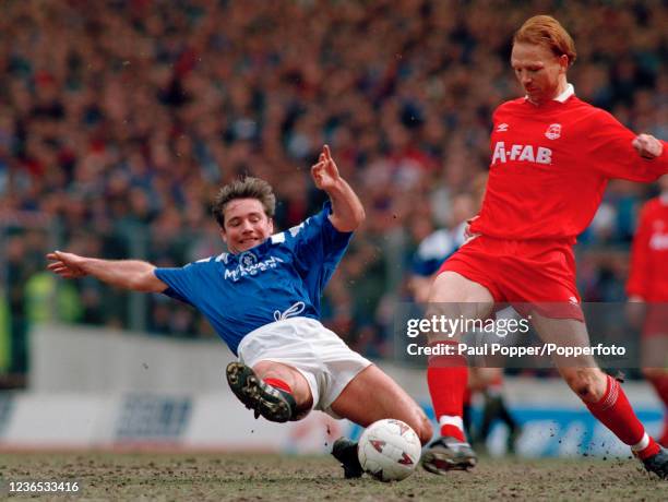 Alex McLeish of Aberdeen is tackled by Ally McCoist of Rangers during a Scottish Premier Division match at Ibrox Stadium on April 2, 1994 in Glasgow,...