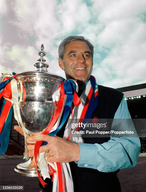 Rangers manager Walter Smith celebrates with the Scottish Premier Division trophy after the final home game of the season against Dundee United at...