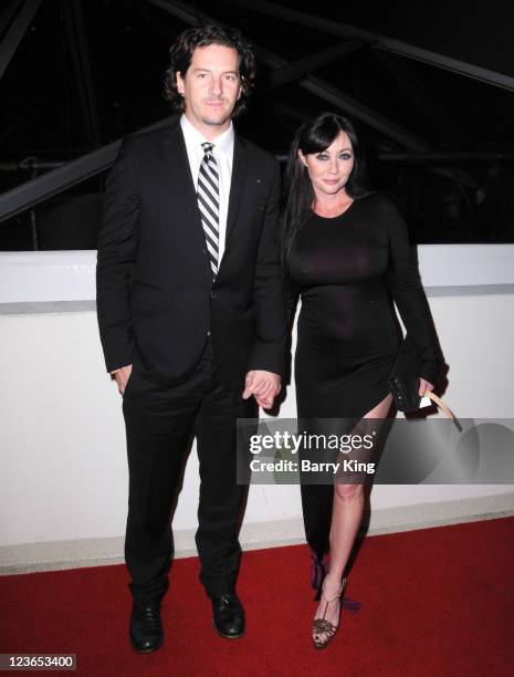 Kurt Iswarienko and actress Shannen Doherty arrive at The Weinstein Company and Realativity Media's 2011 Golden Globes after party held at Bar 210...