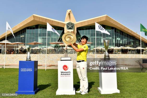 Mizuki Hashimoto of Japan poses with the trophy and the AIG Womens open and Amundi Evian championship trophies following her victory during Day Four...