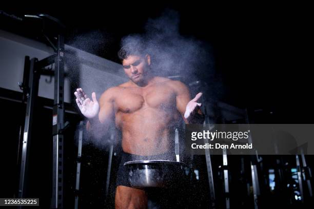 Chris Kavvalos applies chalk to his hands during a workout at City Gym on May 31, 2020 in Sydney, Australia. IFBB body builder Chris Kavvalos has...