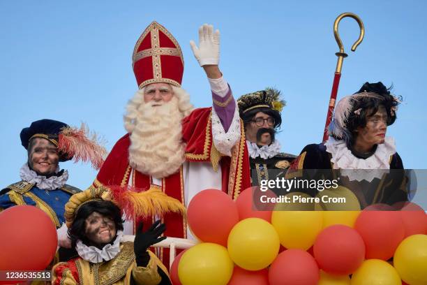 Sinterklaas arrives by boat as thousands of local residents attend the traditional arrival of Sinterklaas and his black Petes in the port of The...