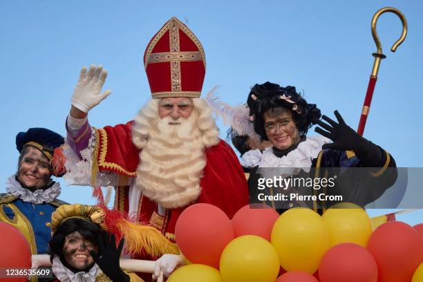 Sinterklaas arrives by boat as thousands of local residents attend the traditional arrival of Sinterklaas and his black Petes in the port of The...