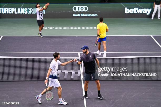 Argentina's Andres Molteni and Mexico's Santiago Gonzalez celebrate during their doubles final match against Pakistan's Aisam-Ul-Haq Qureshi and...