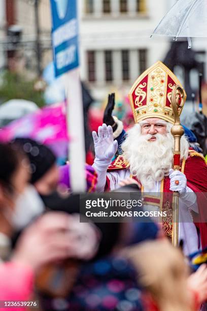 "Sinterklaas" is greeted by wellwishers upon his arrival ahead of Christmas festivities in Antwerp, on November 13 2021. - Sinterklaas is a...