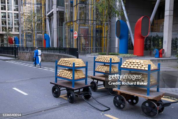 Gold bullion models are seen on London Wall before the Lord Mayor's Show in the City of London, the capital's financial and historic district, on...